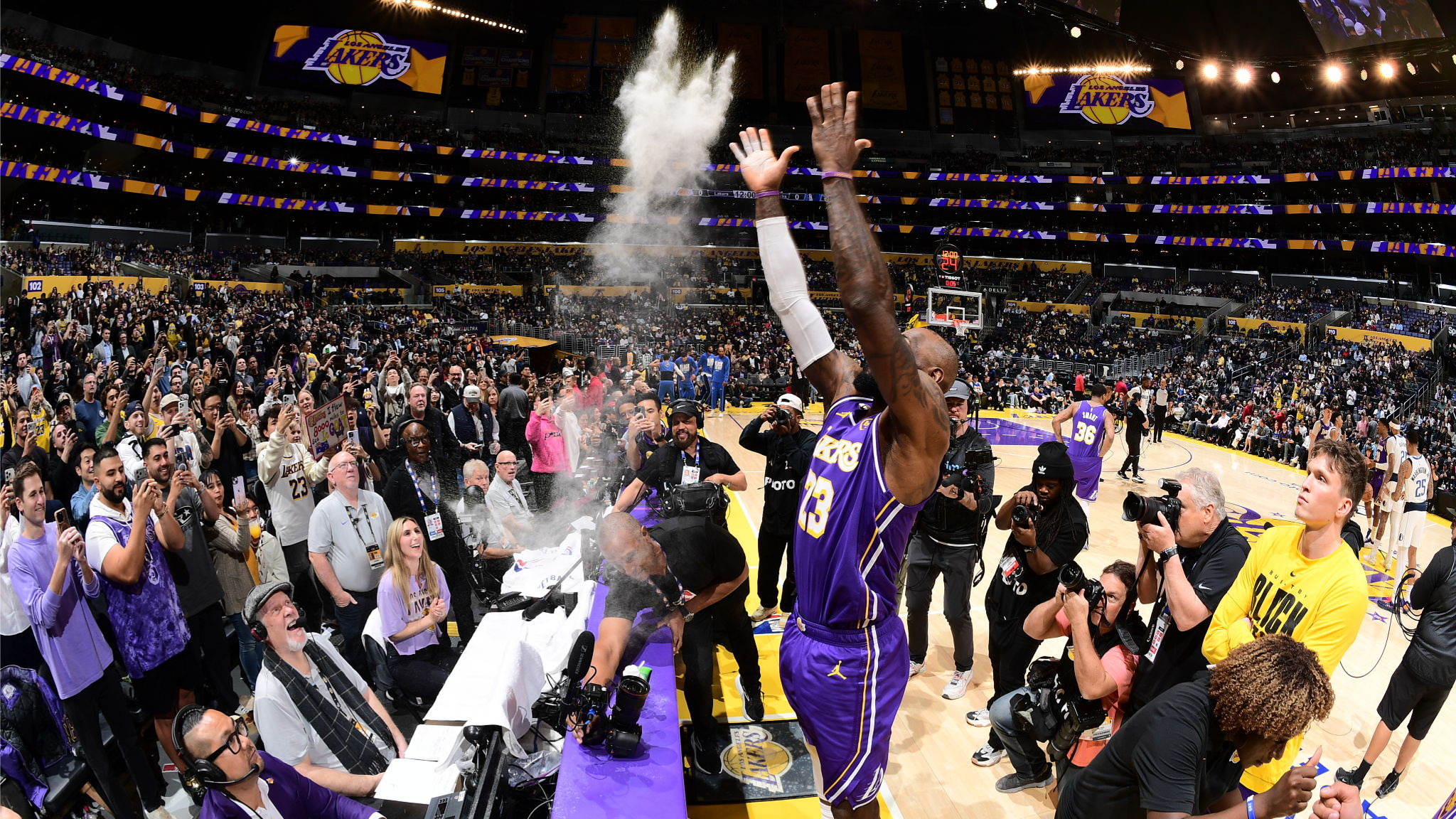 Basketball player V.J. Edgecombe in a Philadelphia 76ers jersey, looking focused on the court.